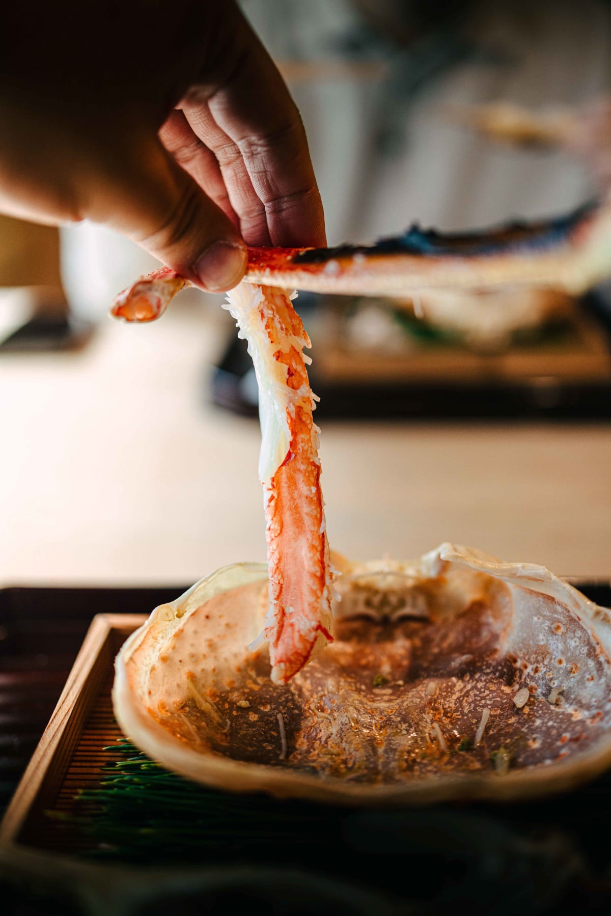 Matsukawa, Tokyo: leg meat lifted above the crab shell