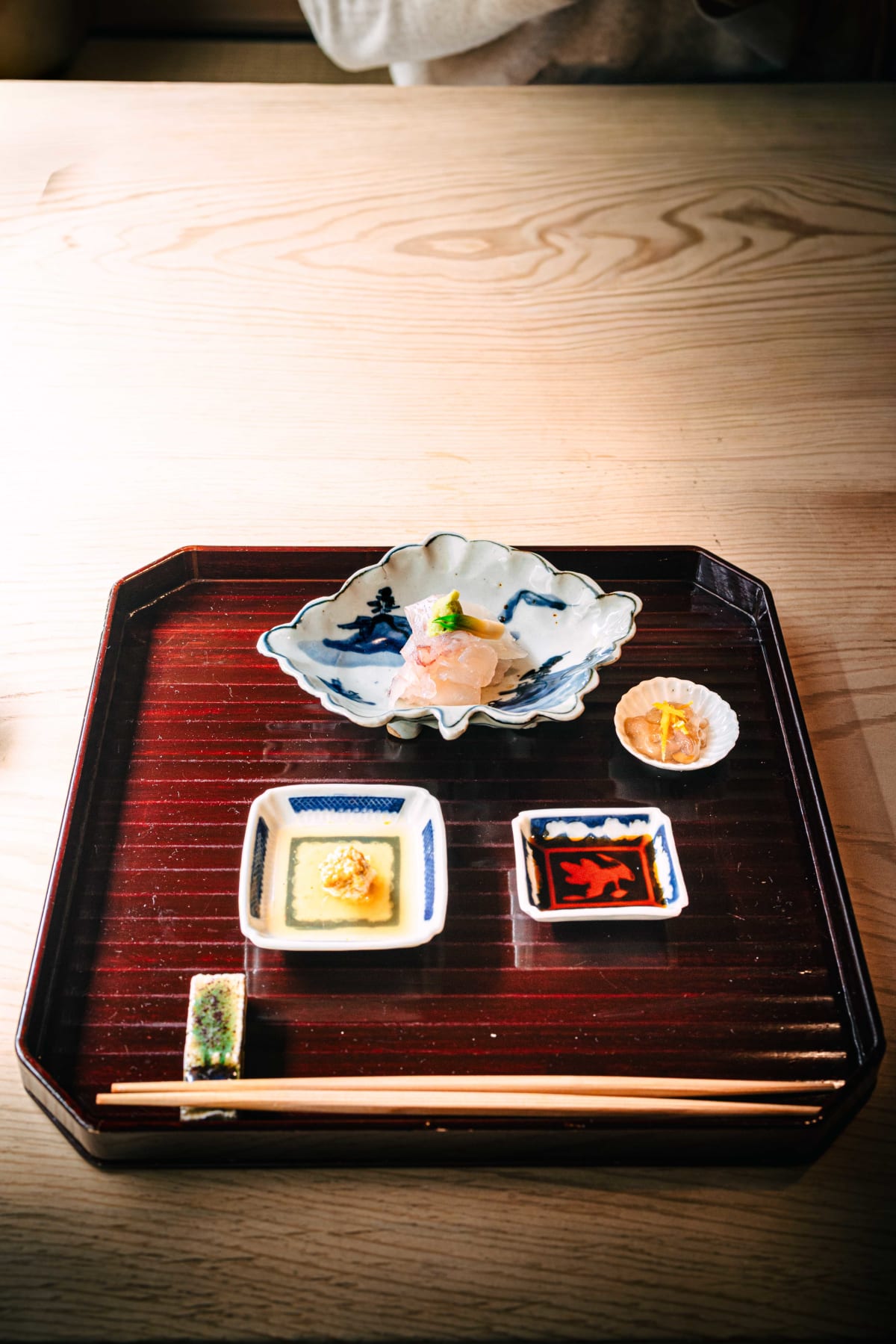 Matsukawa, Tokyo: the red lacquer sashimi tray, then ise-ebi topped with its own miso in a light amber dressing