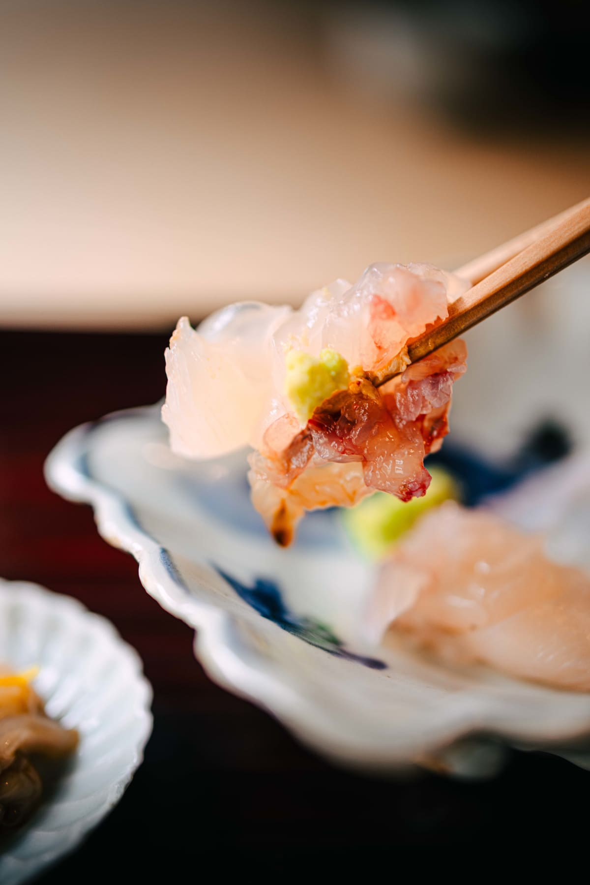 Matsukawa, Tokyo: ise-ebi and madai lifted together with chopsticks, a dab of wasabi on top