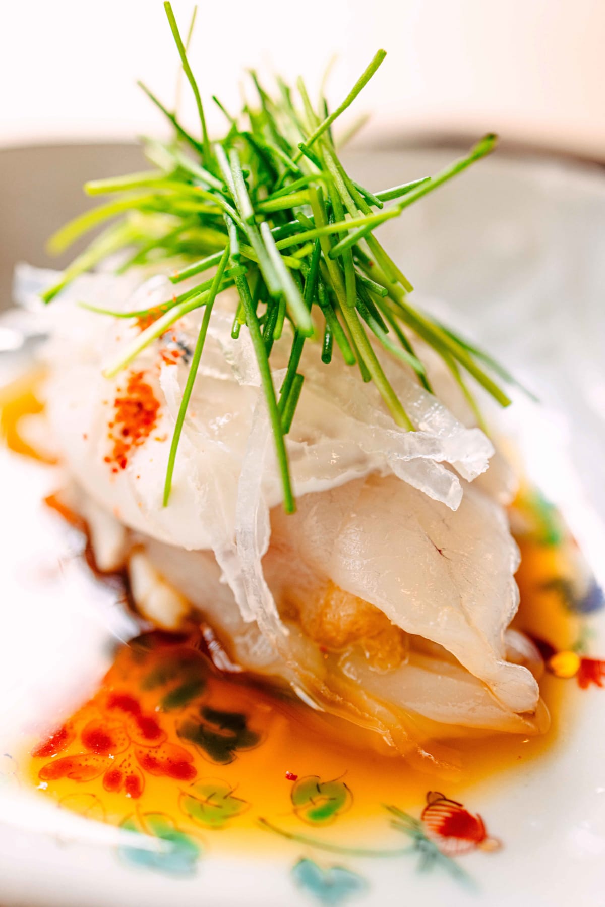 Matsukawa, Tokyo: the fugu up close, momiji-oroshi and chives over the sliced flesh