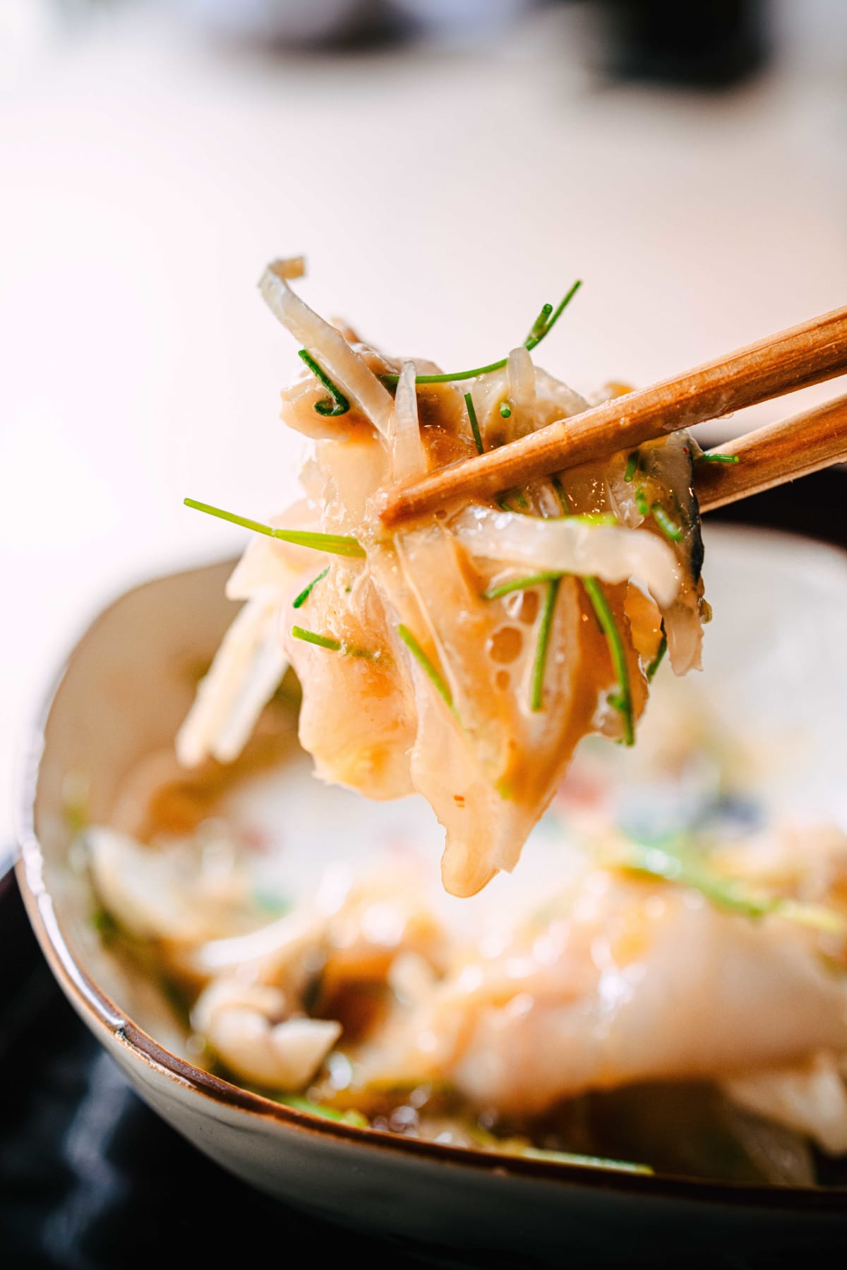 Matsukawa, Tokyo: fugu flesh and skin lifted with chopsticks