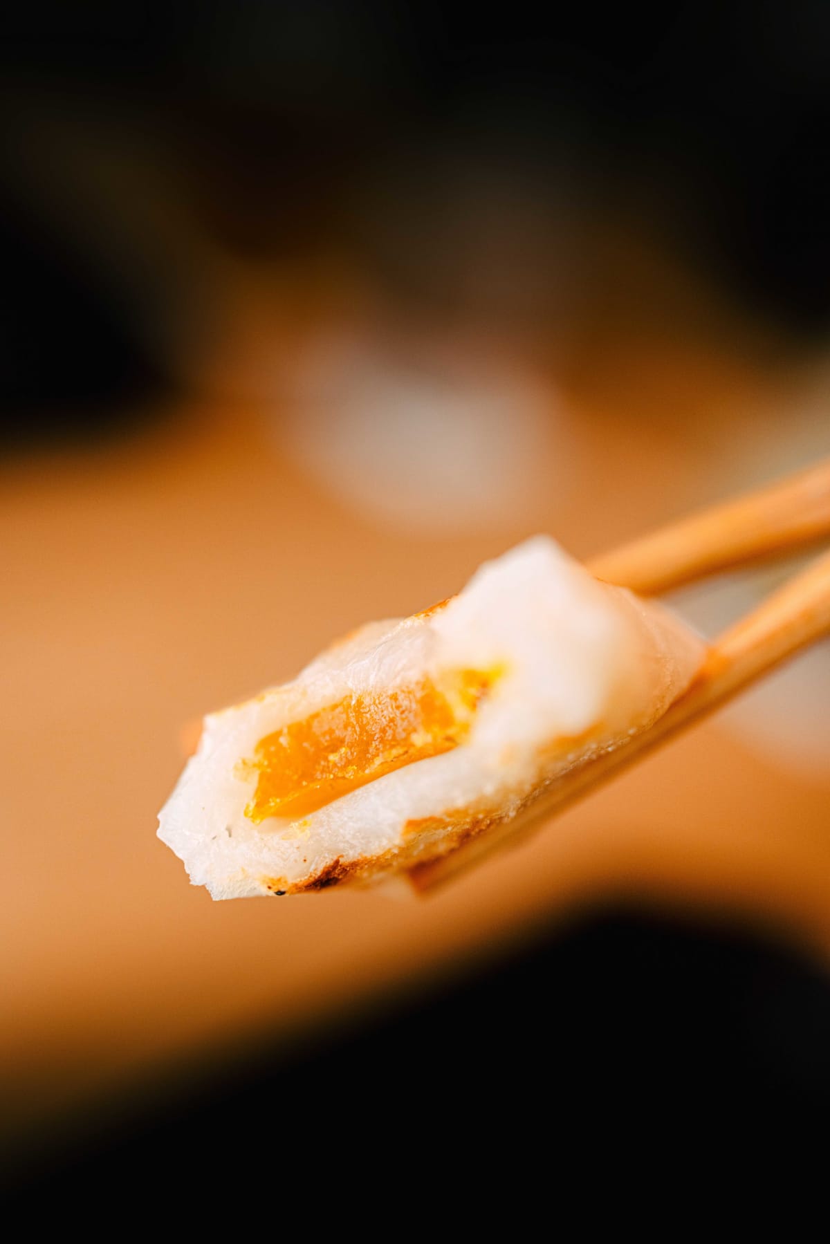 Matsukawa, Tokyo: karasumi mochi cut open, the orange mullet roe inside