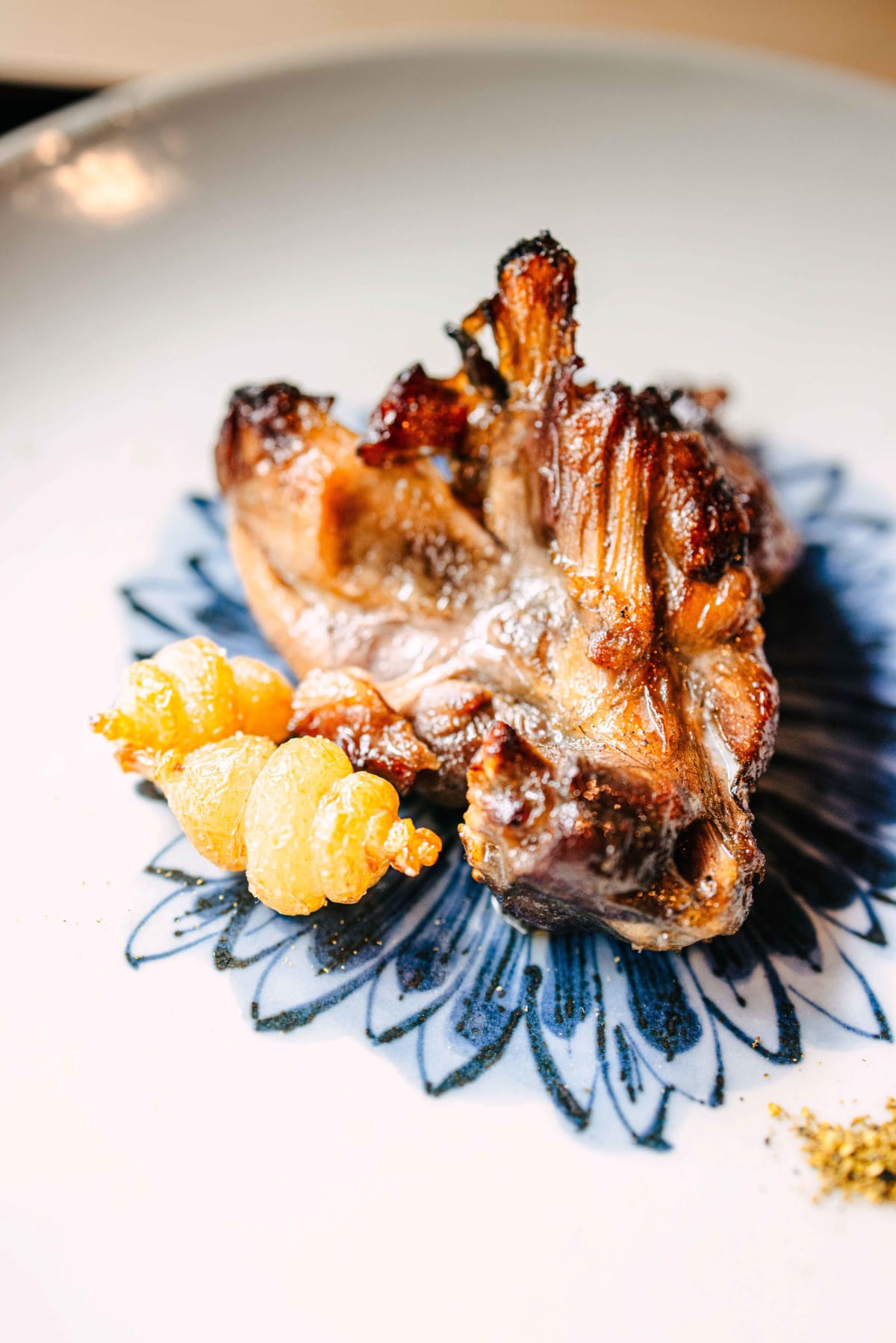 Matsukawa, Tokyo: the tare-glazed turtle up close, a small golden garnish beside it