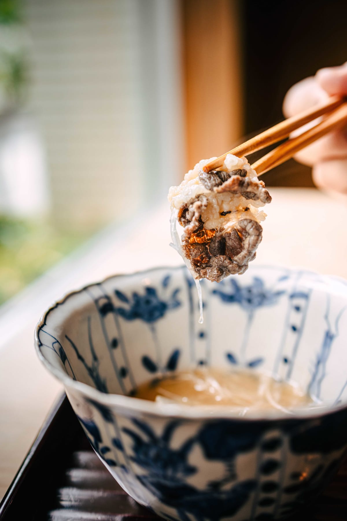 Matsukawa, Tokyo: a slice of bear meat lifted from the broth