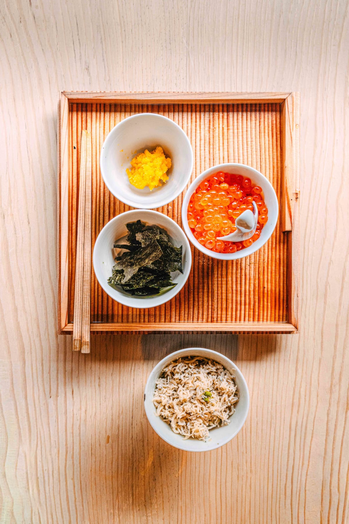 Matsukawa, Tokyo: the accompaniments on a wooden tray: ikura, nori and the small dried fish