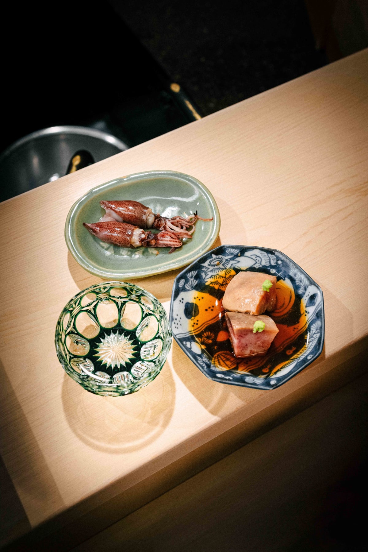 Nihonbashi Kakigaracho Sugita, Tokyo: ankimo and hotaruika from above, with a green cut-glass cup of Hinotori
