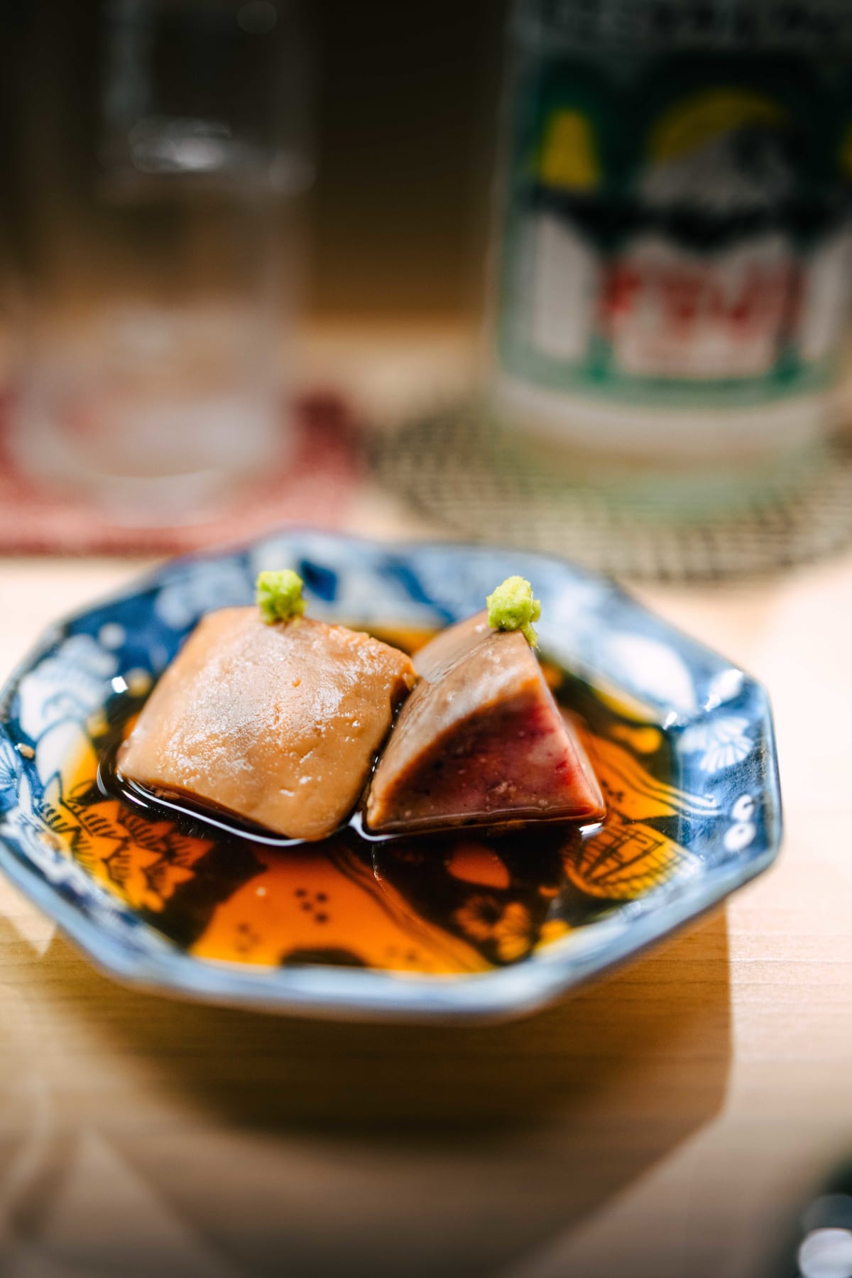 Nihonbashi Kakigaracho Sugita, Tokyo: ankimo, two pieces of monkfish liver in a dark, glossy sauce, each topped with wasabi