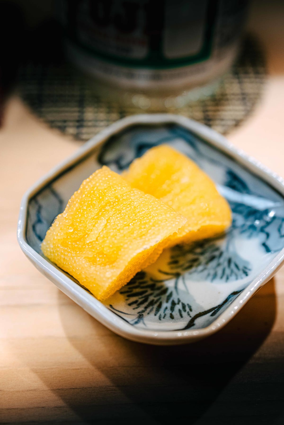 Nihonbashi Kakigaracho Sugita, Tokyo: misozuke kazunoko, two golden slabs of herring roe in a hexagonal blue and white dish