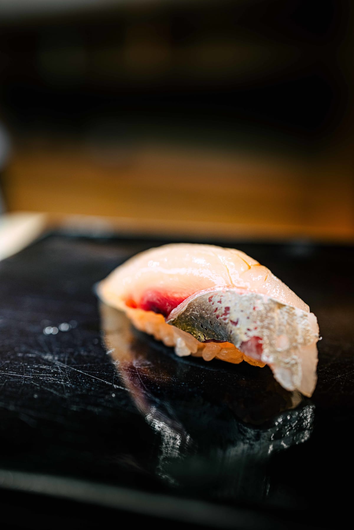 Nihonbashi Kakigaracho Sugita, Tokyo: the shima-aji up close, a seam of red running through the pale flesh
