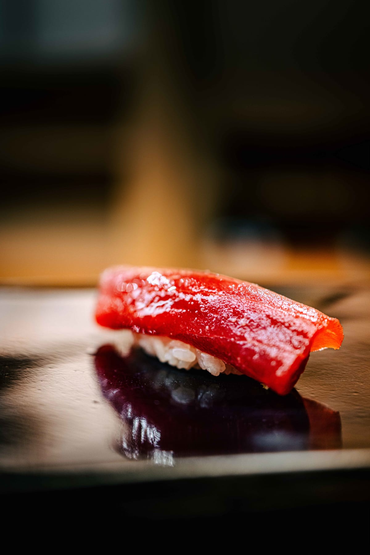 Nihonbashi Kakigaracho Sugita, Tokyo: akami nigiri, deep red and glossy, on the black lacquer board