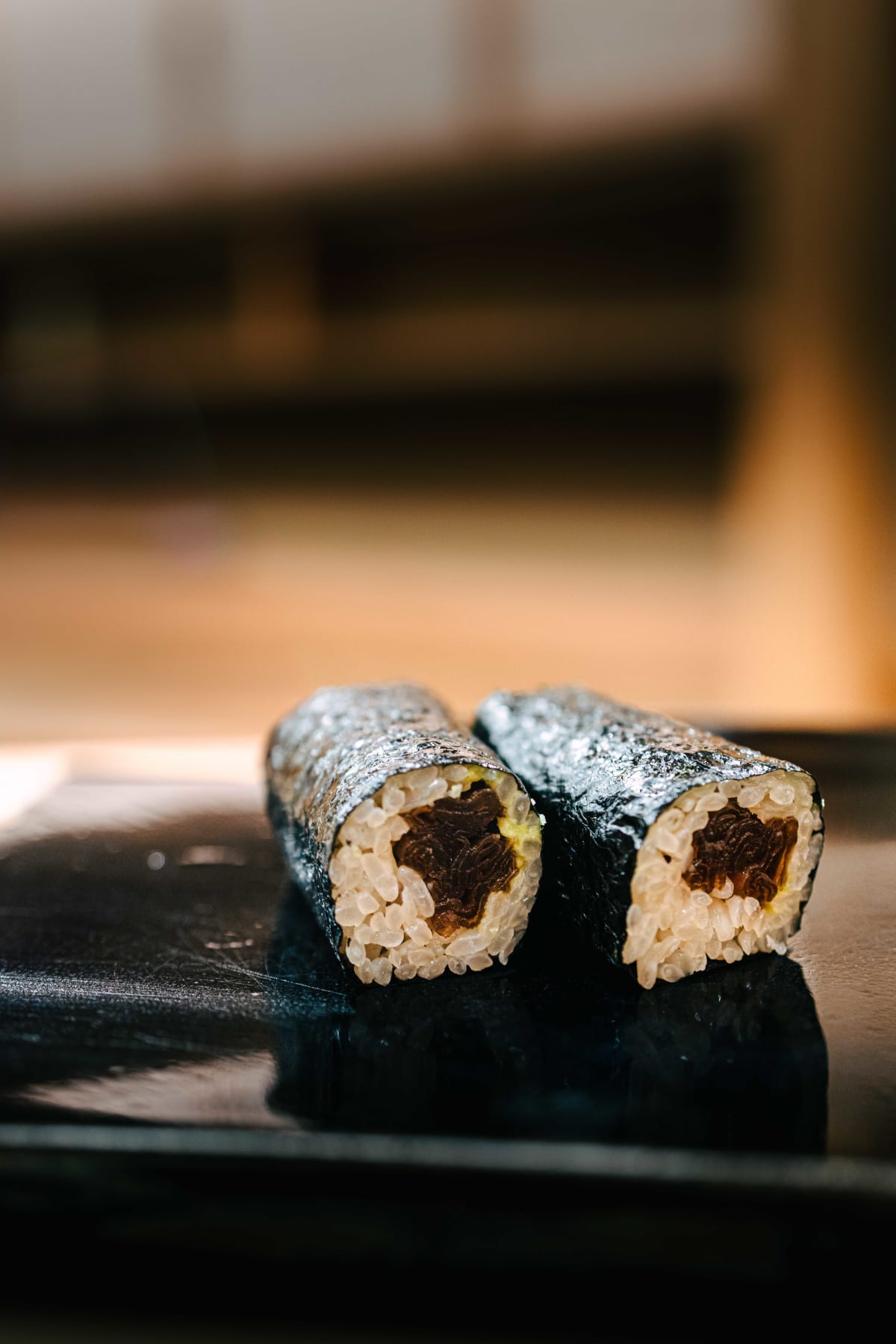 Nihonbashi Kakigaracho Sugita, Tokyo: kanpyo maki cut to show the dark simmered gourd, then a block of gyoku