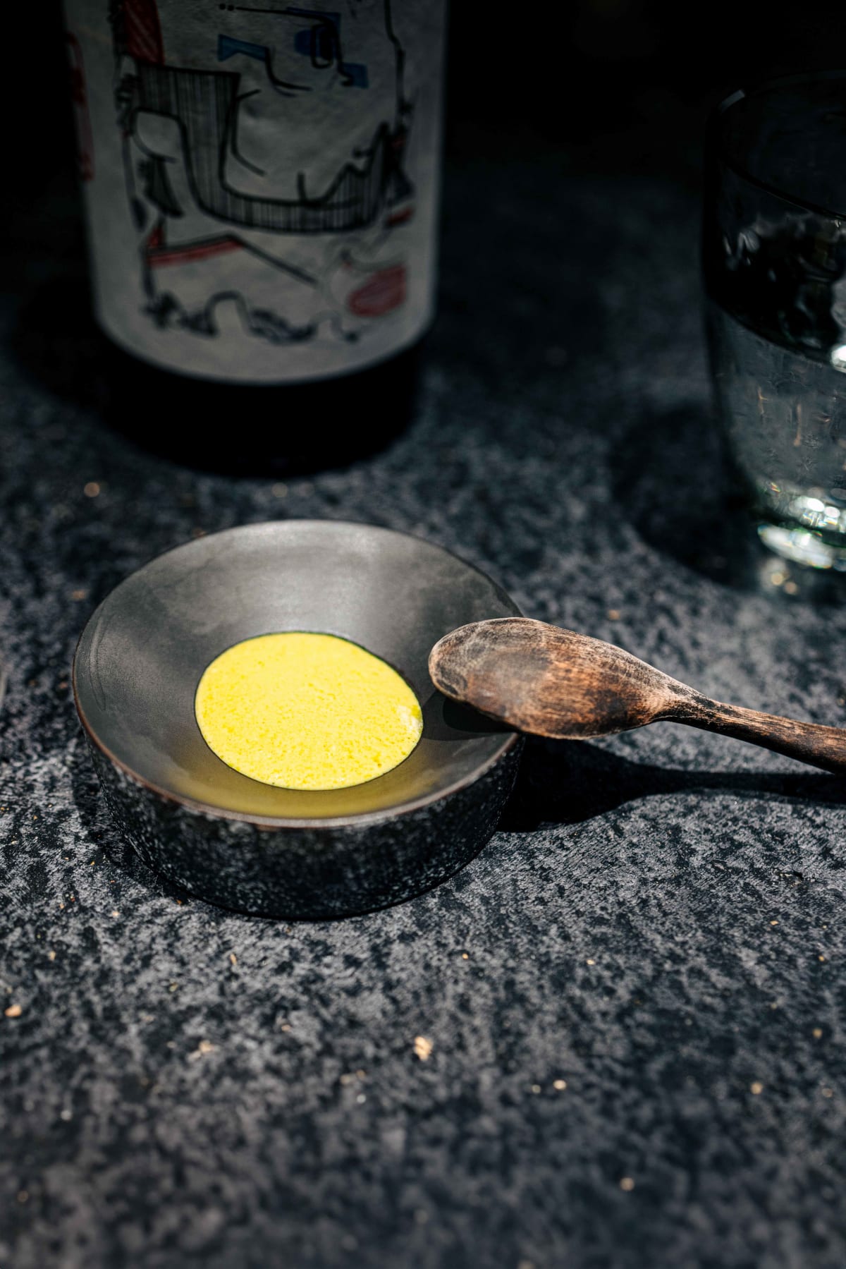 Florilège, Tokyo: the yellow-green salsa in a stone dish, then the jerky taco in hand