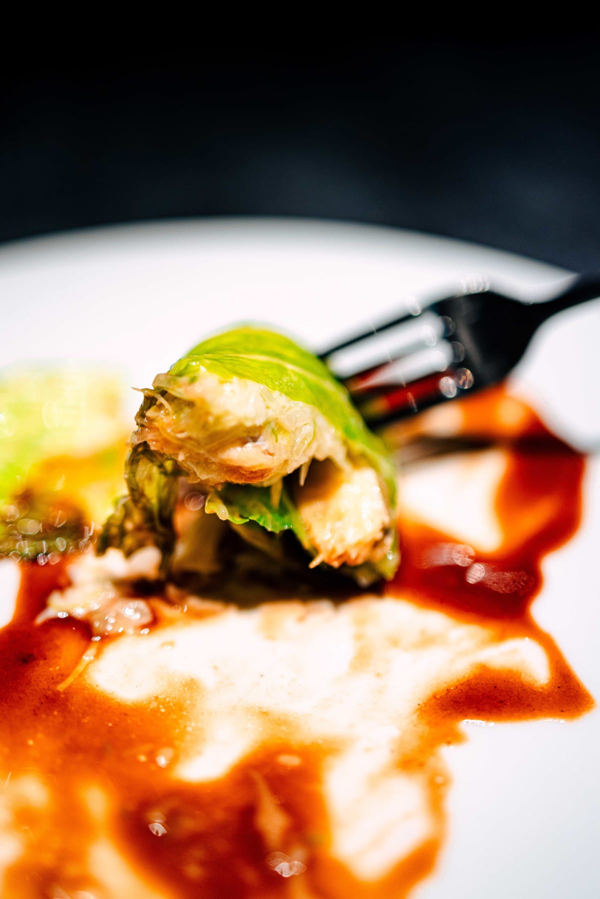 Florilège, Tokyo: the cabbage parcel cut open with a fork, moroko and scallop mousse inside