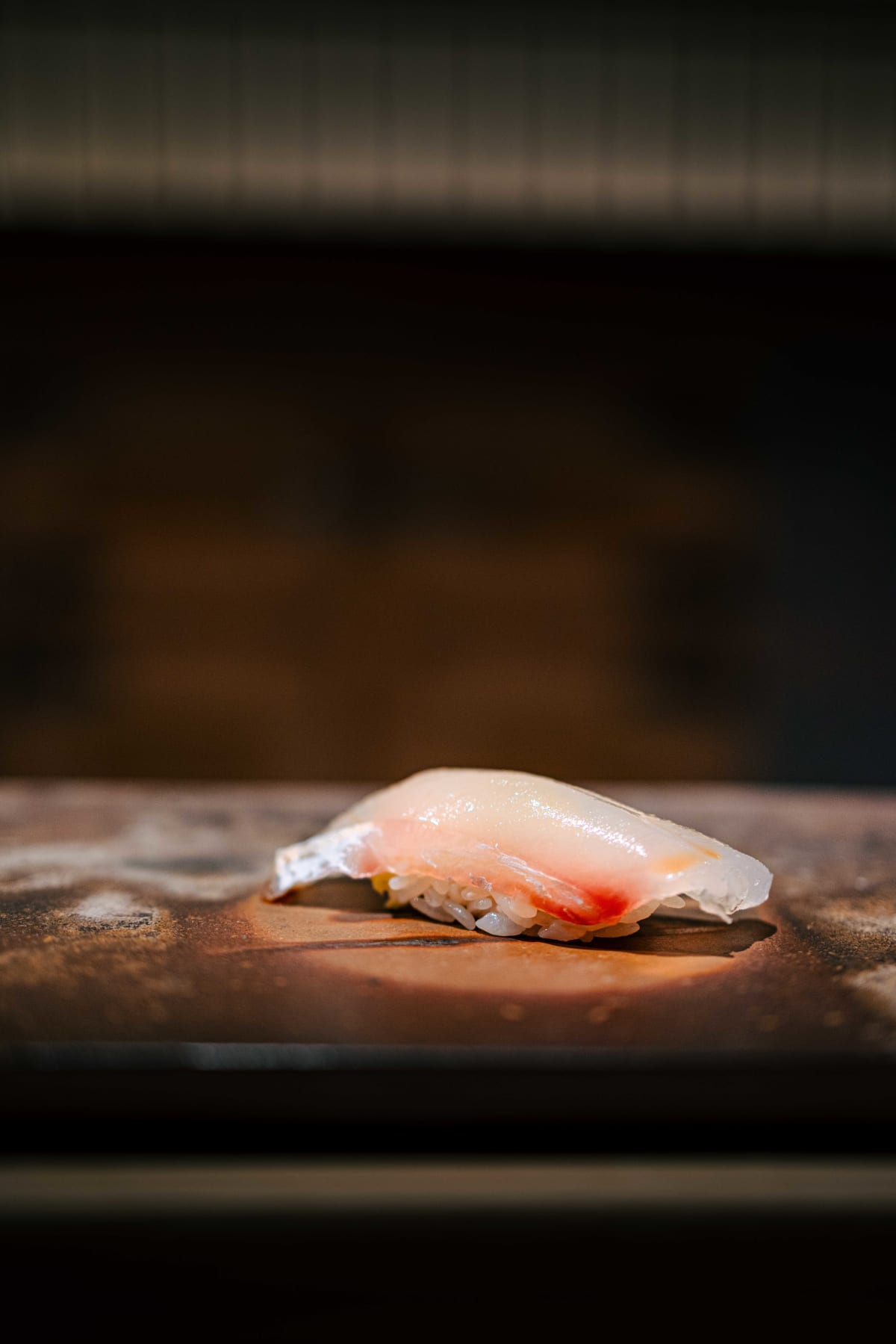 Sushi Juyon by Saito, Seoul: the first nigiri of the first visit, white fish over shari with the grain of the rice visible
