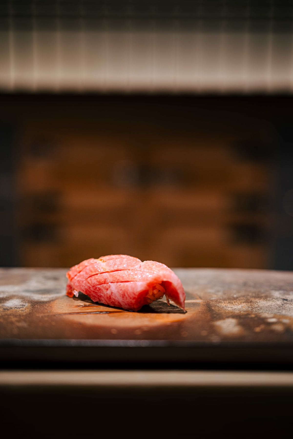 Sushi Juyon by Saito, Seoul: otoro nigiri, scored across its surface