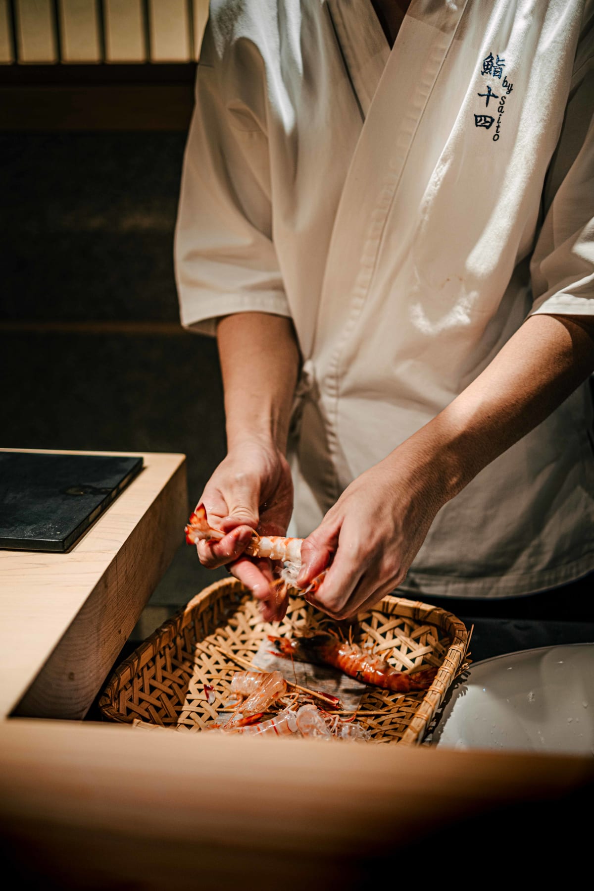 Sushi Juyon by Saito, Seoul: kuruma-ebi taken from the bamboo basket and peeled at the counter, then prepared again on the second visit