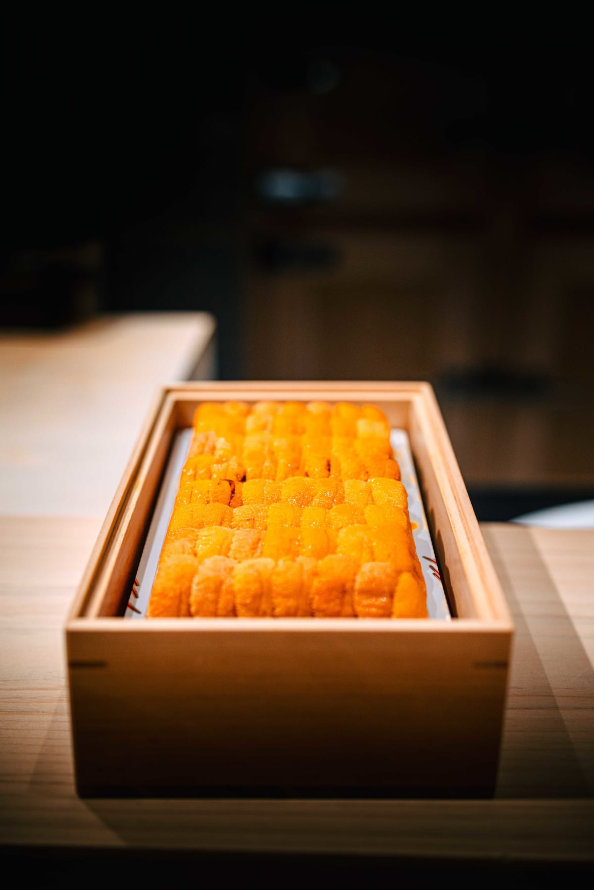 Sushi Juyon by Saito, Seoul: uni packed into a wooden box, then set on nori with shari and handed over, on both visits