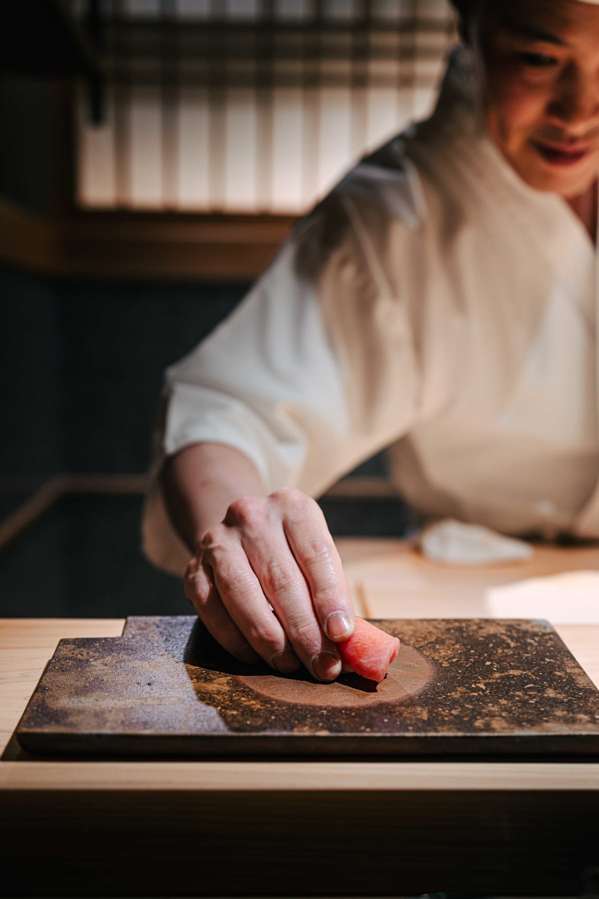 Sushi Juyon by Saito, Seoul: on the second visit, the taisho smiling as he sets down the chutoro, the chutoro, then the otoro