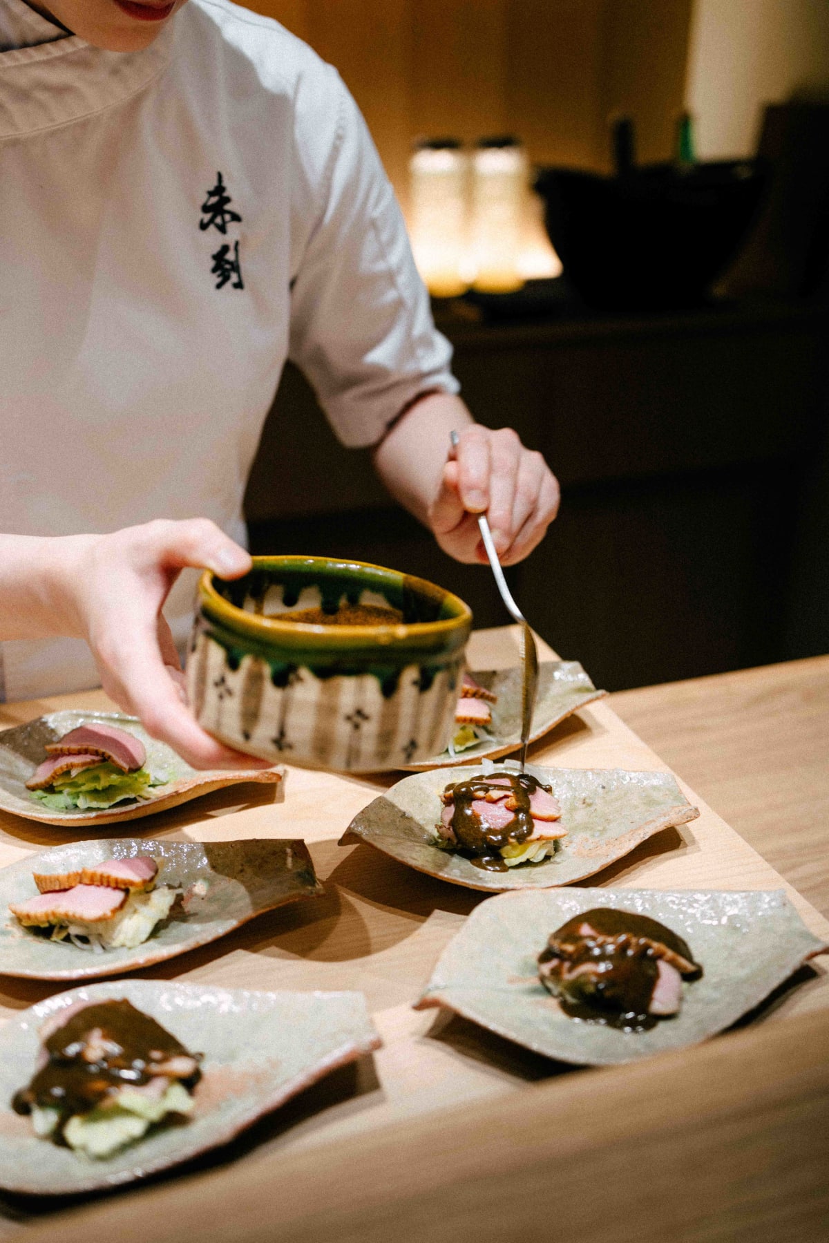 Mitou, Seoul: black sesame sauce spooned over the duck
