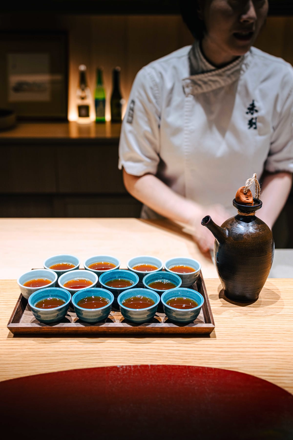 Mitou, Seoul: cups of the infused vodka beside its earthenware jug