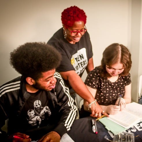 Educator working with students