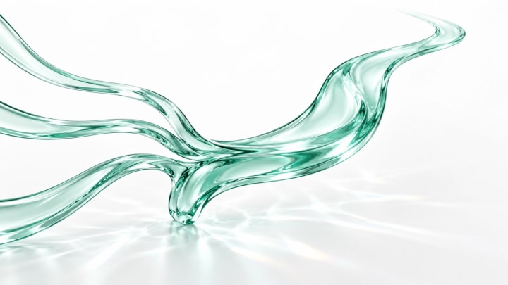 Abstract green glass ribbons flowing across a white surface