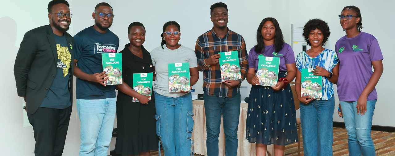 Young Green Entrepreneurs holding YGE catalogues