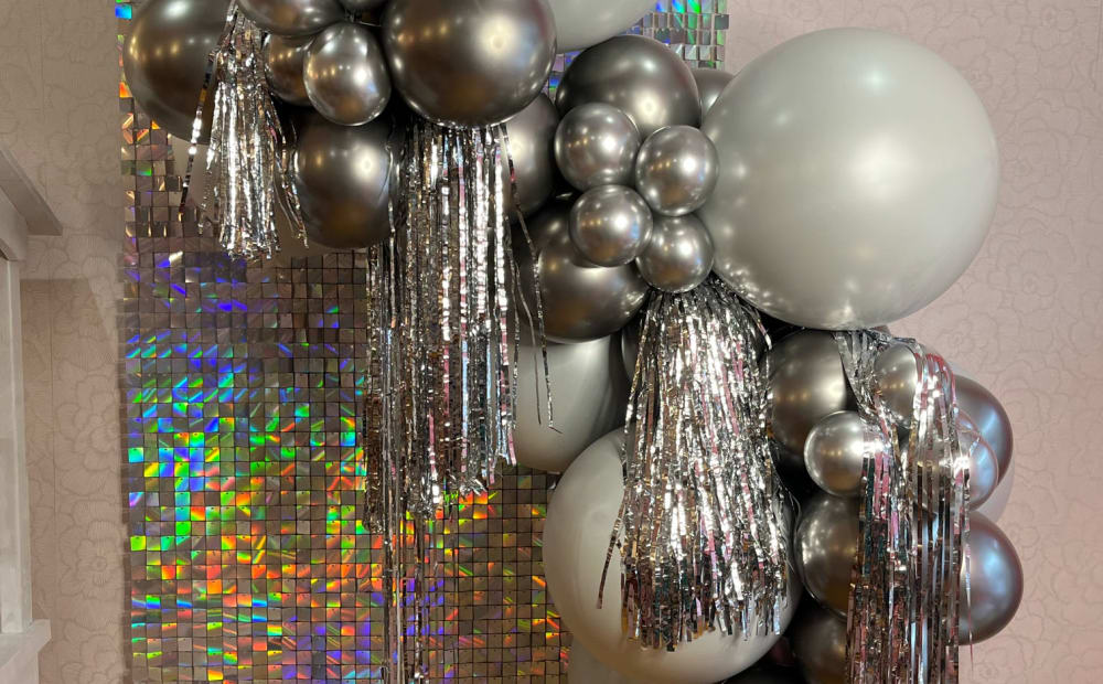 Pastel shower setup with balloons and soft styling