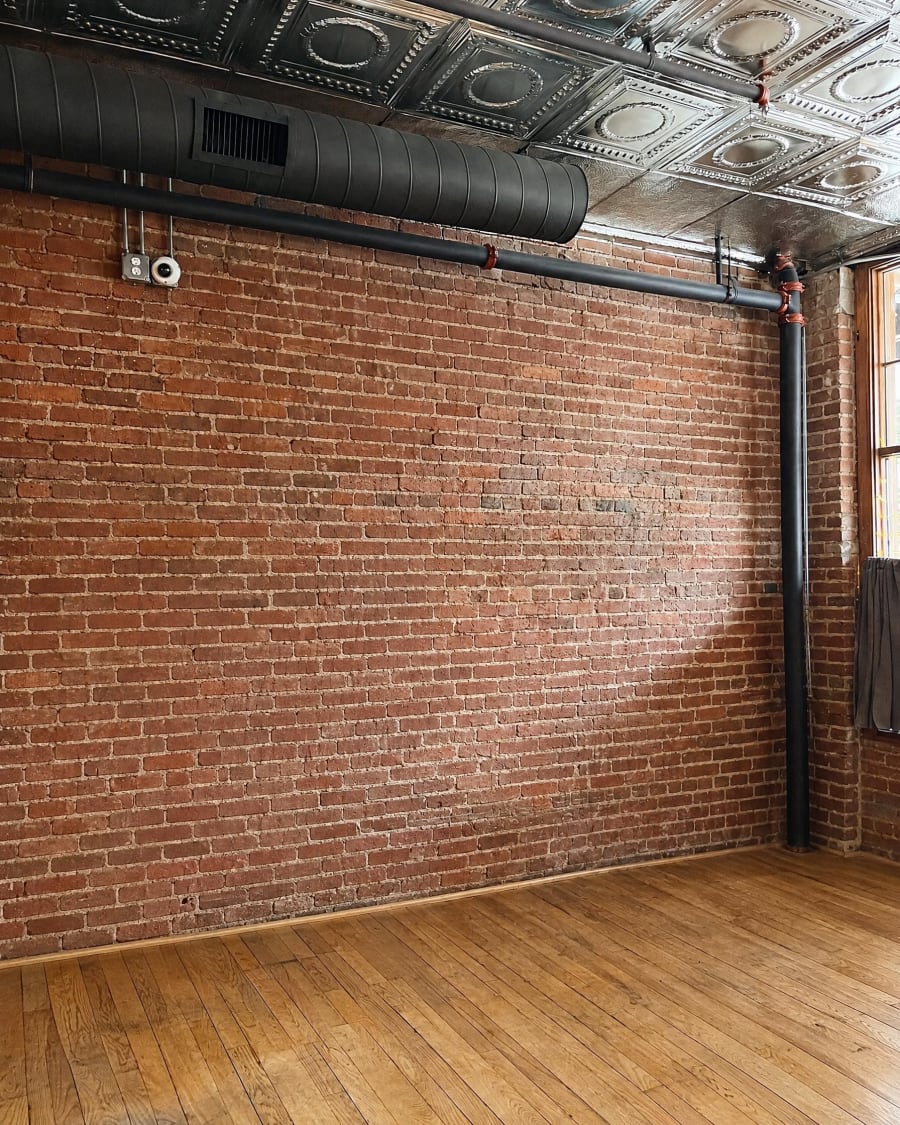 The same room before the decor, with an empty wall