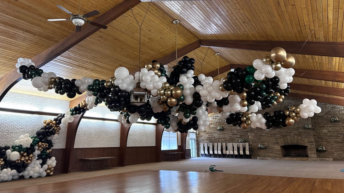 Colorful balloon arch and backdrop styled by Party on Butler for a Pittsburgh celebration, showcasing full event planner deco