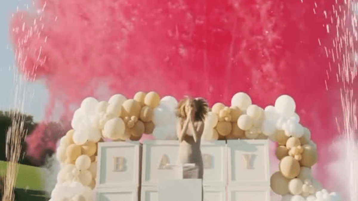 Colorful pink and blue balloon arch and garland styled by Party on Butler for a Pittsburgh gender reveal party