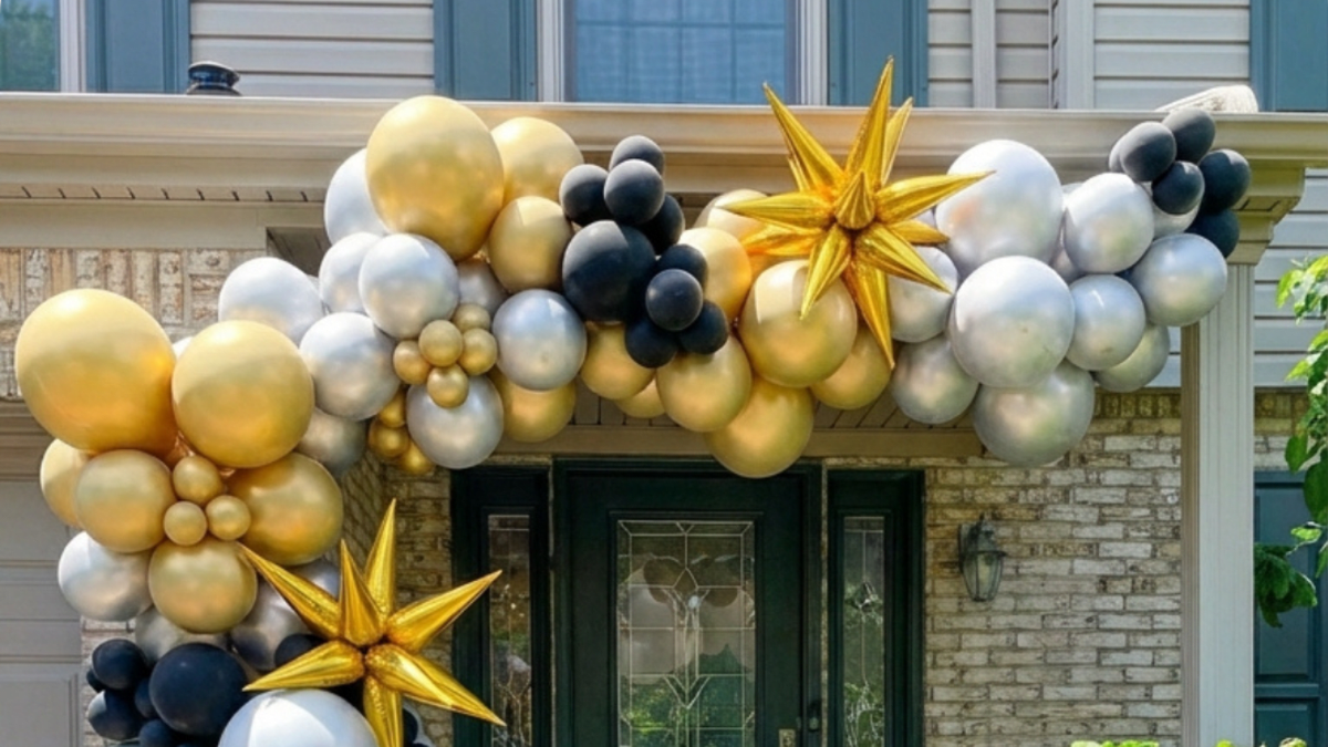 Colorful balloon garland and marquee letters styled for a graduation party by Party on Butler in Pittsburgh