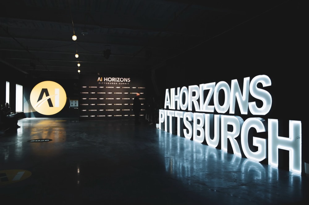 AI HORIZONS PITTSBURGH LED marquee letters across a summit venue by Party on Butler