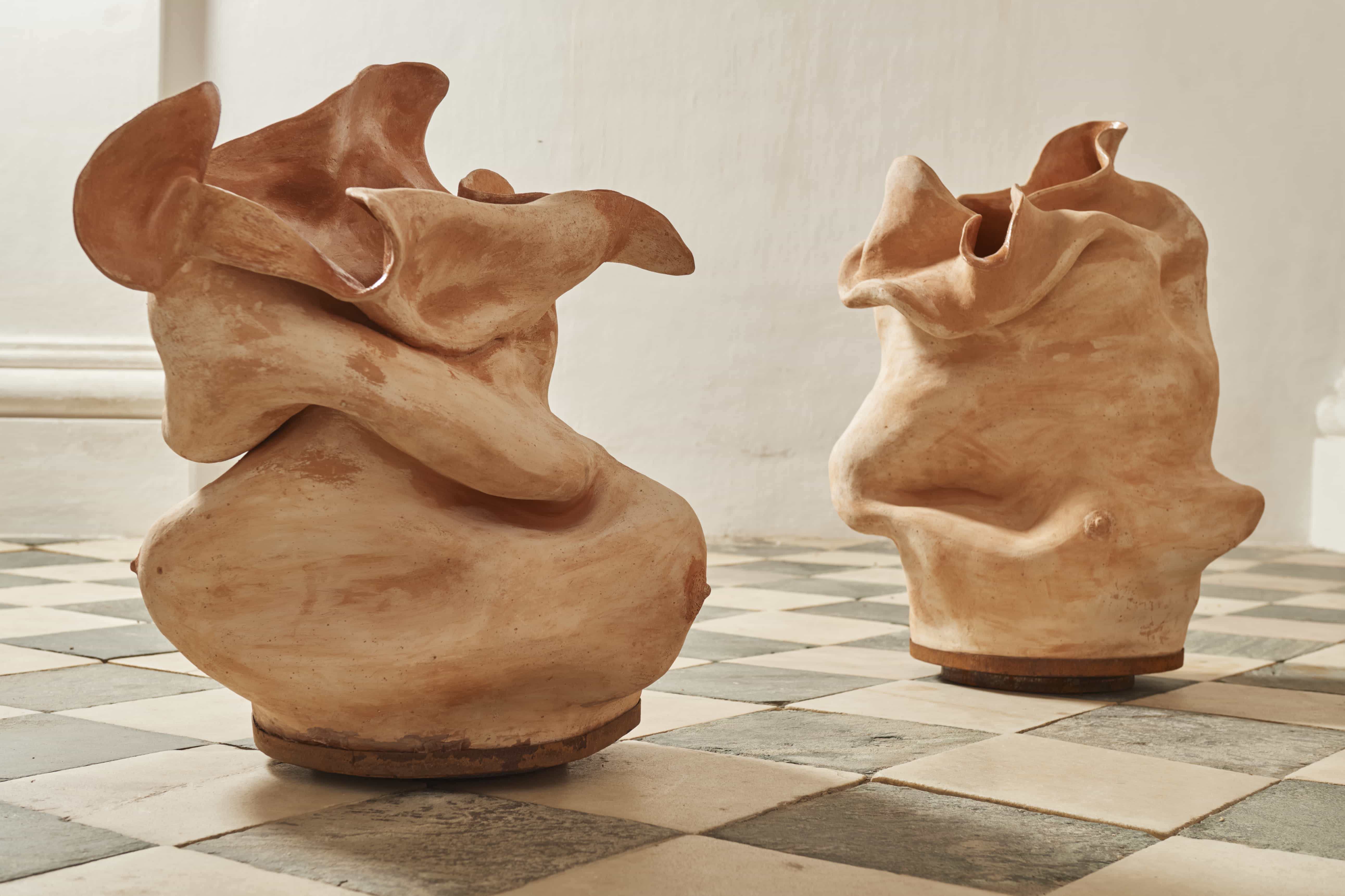 Magda von Hanau, Avá & Iara, 2025, Clay, pigment, resin on an iron turntable base and speakers, 82 x 58 x 62 cm & 75x 62  66 cm