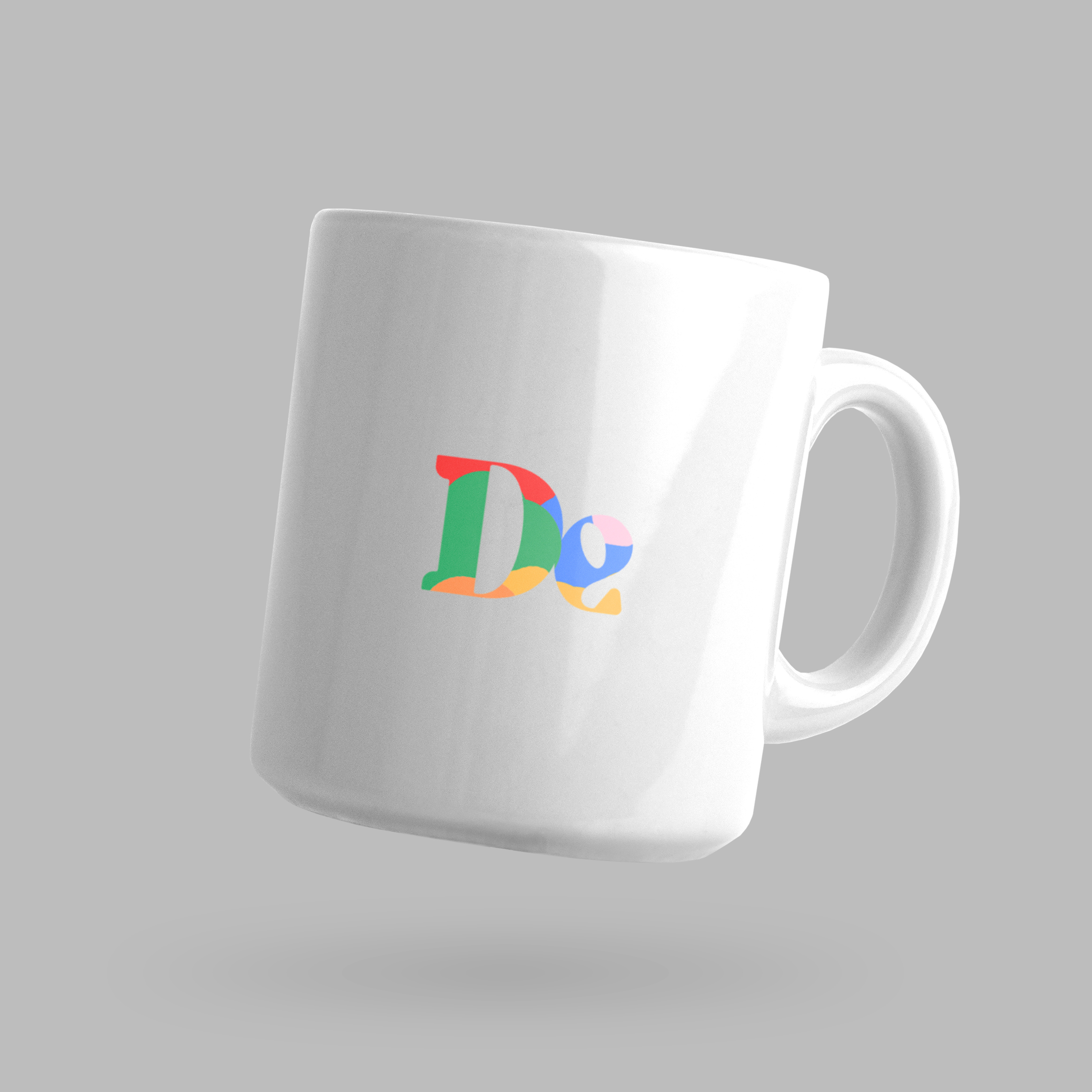 Front of tote bag with washed black canvas body, black straps, and tan leather handles and accents.