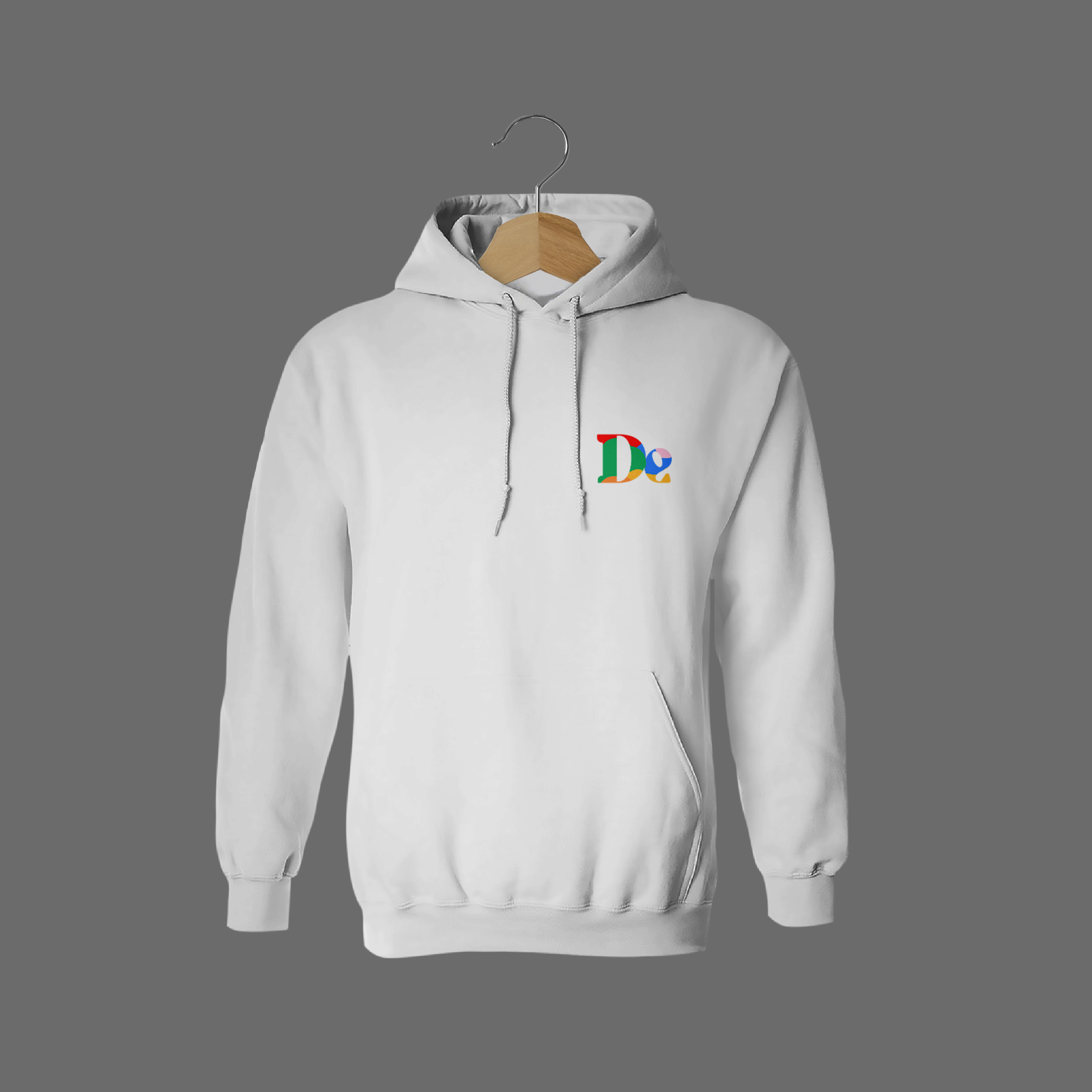 Front of tote bag with washed black canvas body, black straps, and tan leather handles and accents.