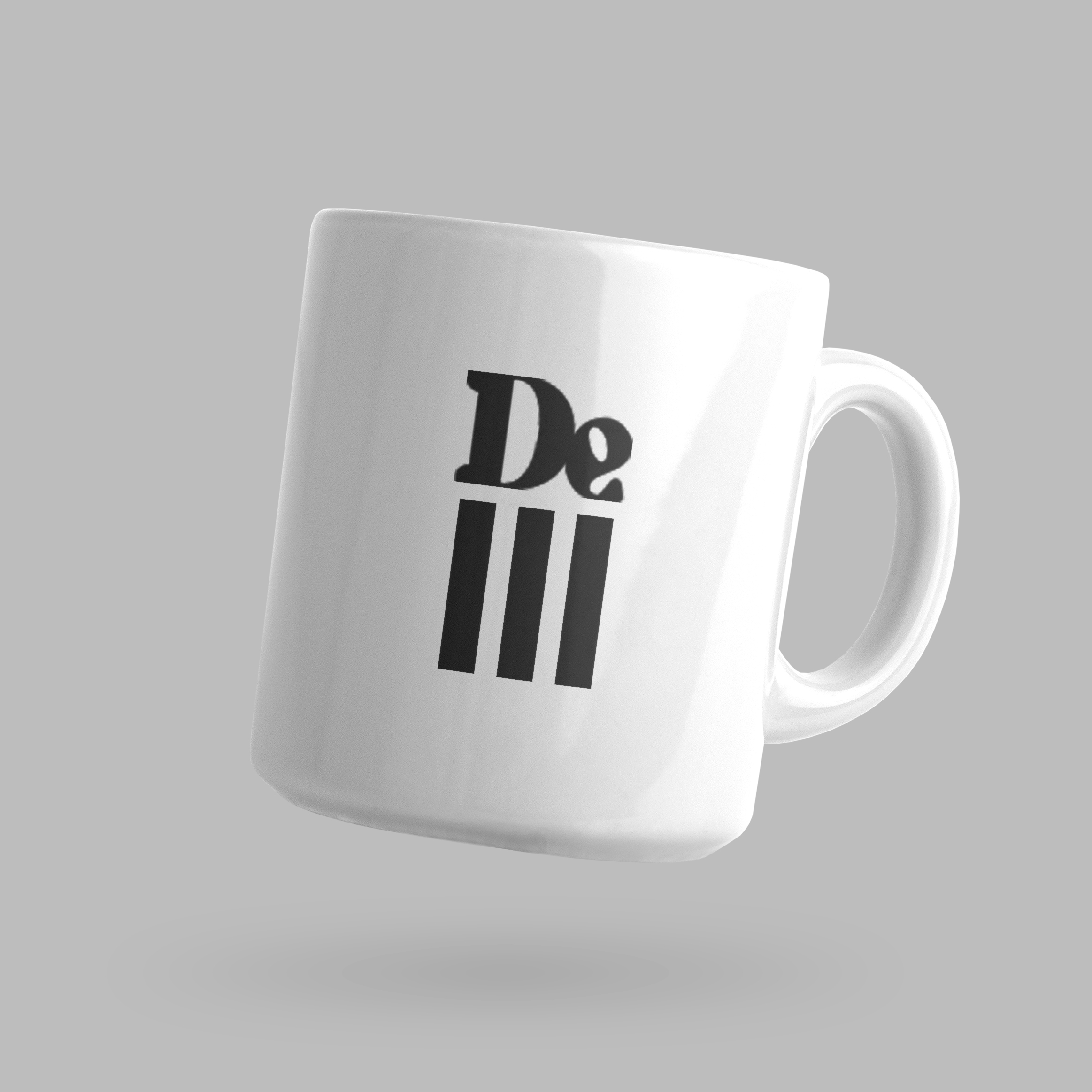 Front of tote bag with washed black canvas body, black straps, and tan leather handles and accents.