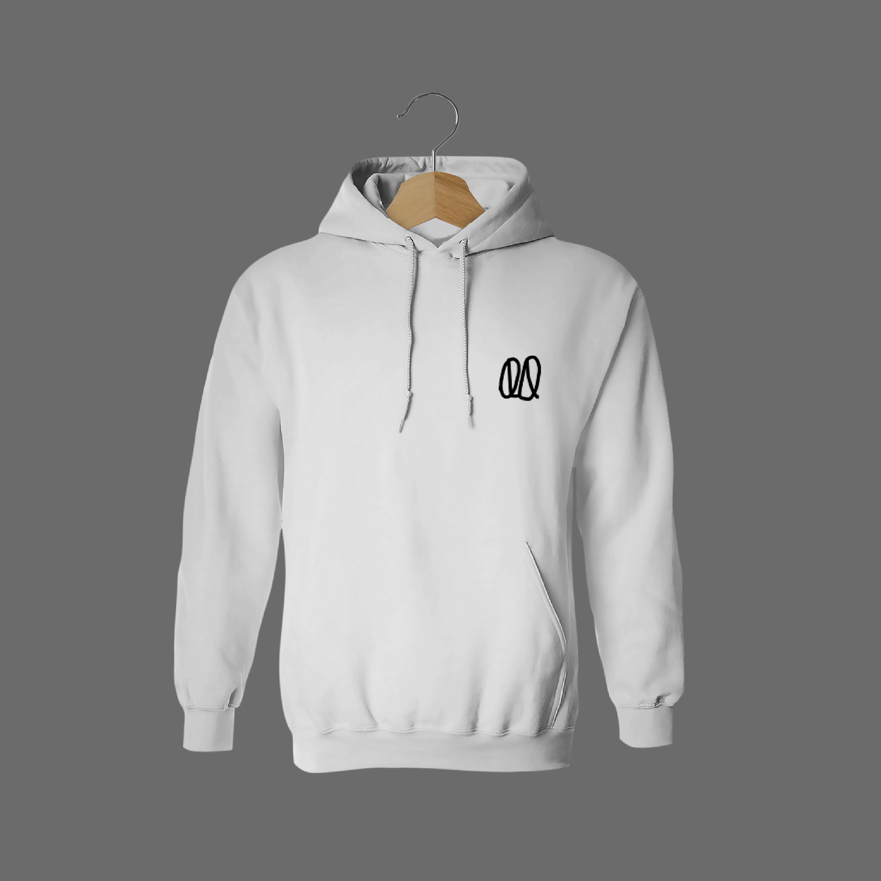 Front of tote bag with washed black canvas body, black straps, and tan leather handles and accents.