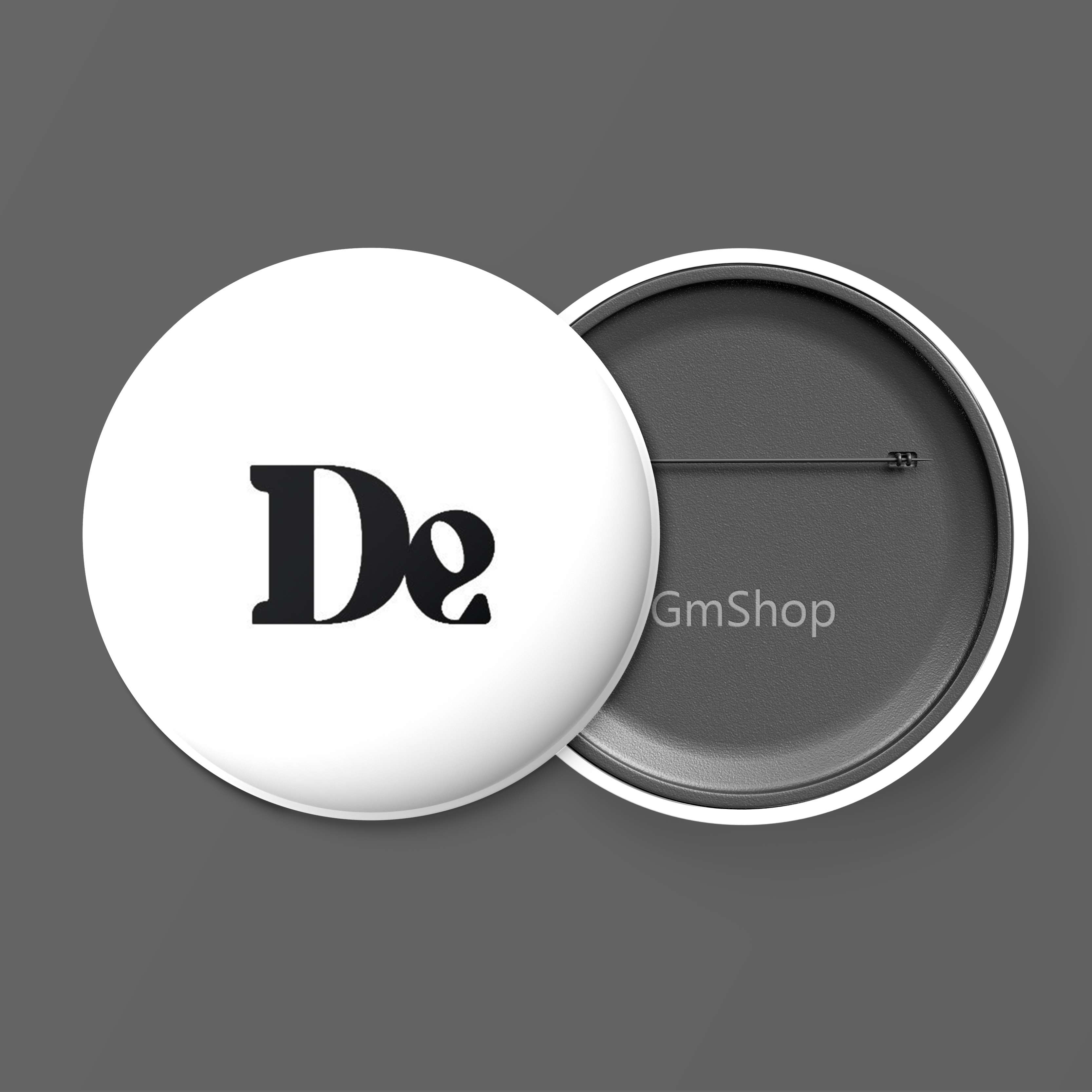 Front of tote bag with washed black canvas body, black straps, and tan leather handles and accents.