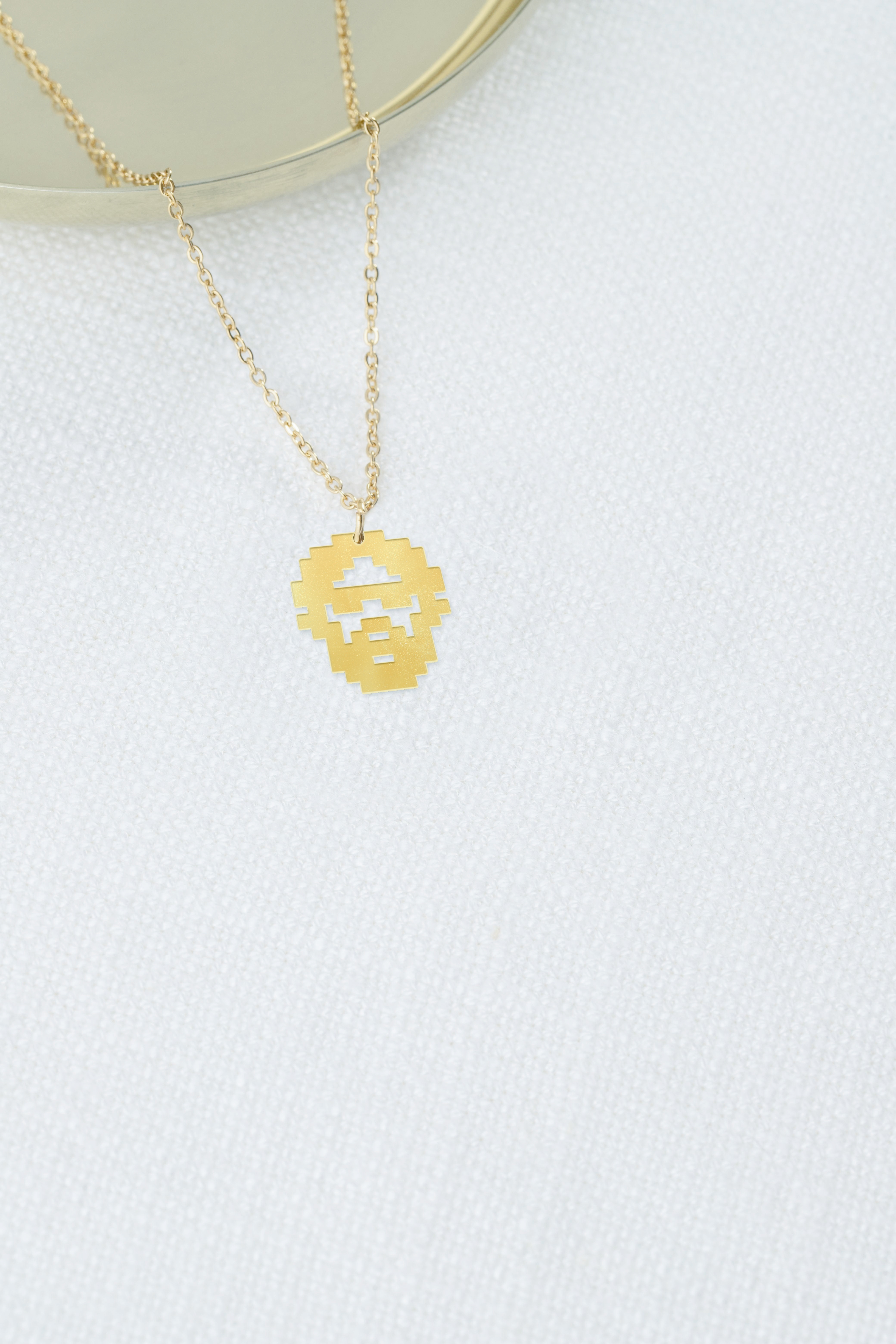 Front of tote bag with washed black canvas body, black straps, and tan leather handles and accents.