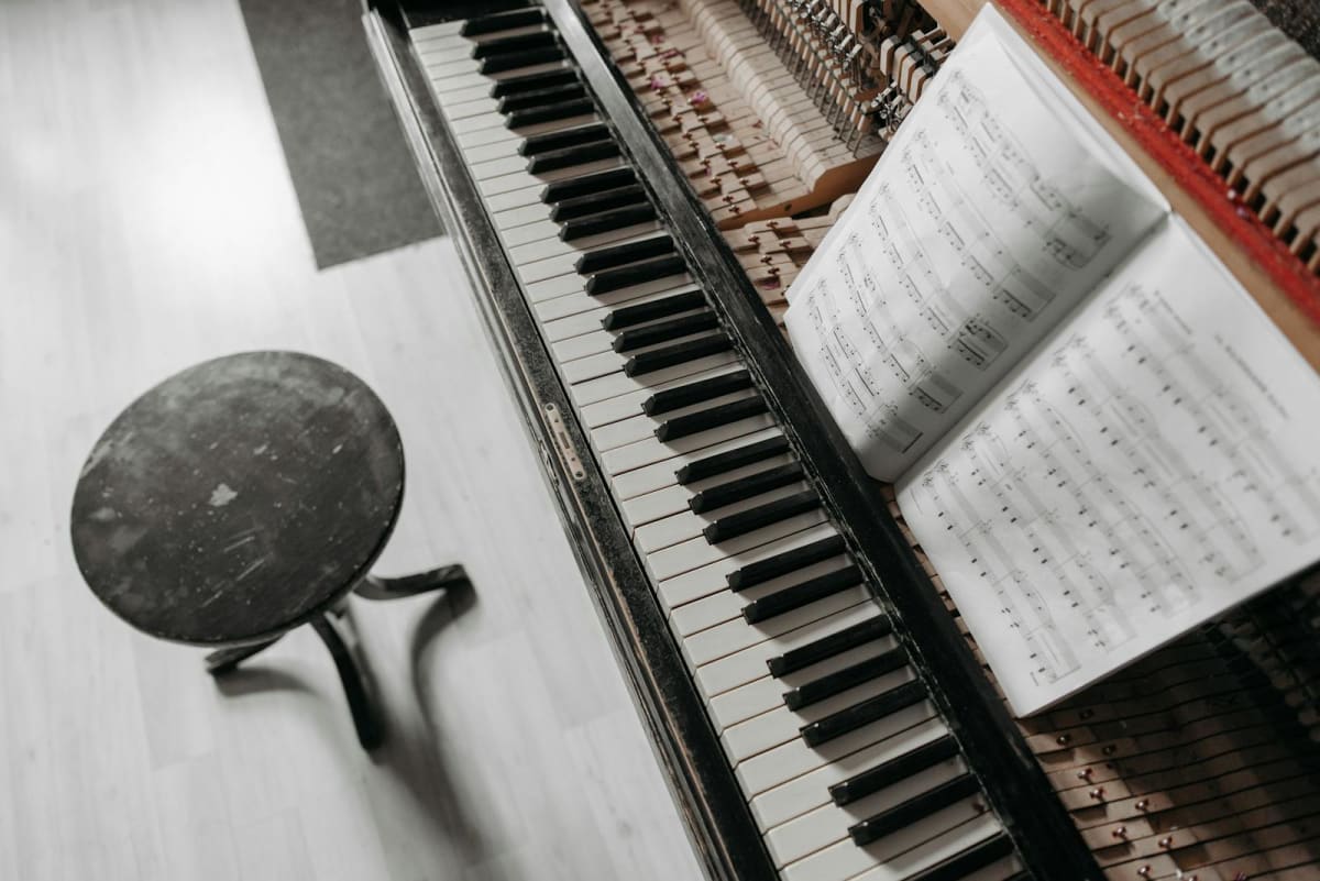 Top view of piano keys and sheet music