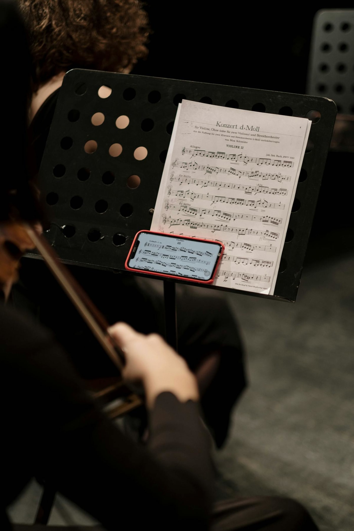 Violinist working through a score during a focused practice session