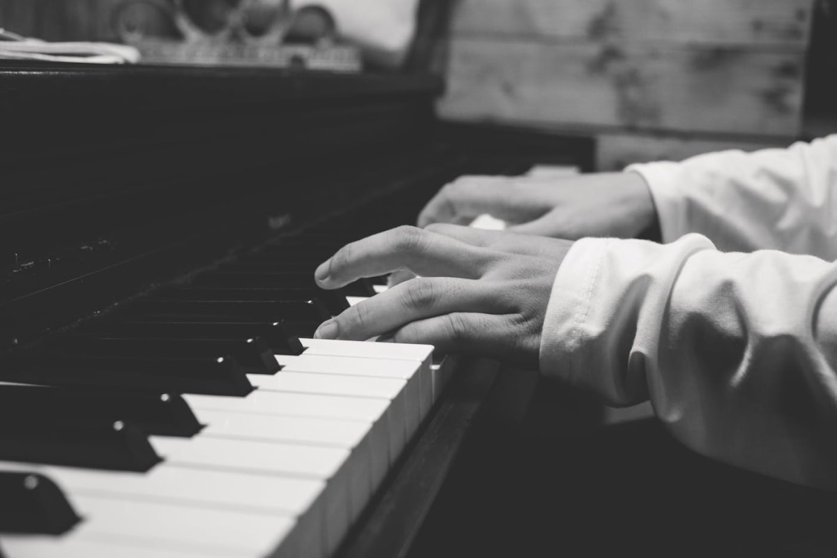 Hands shaping a phrase at the piano keyboard