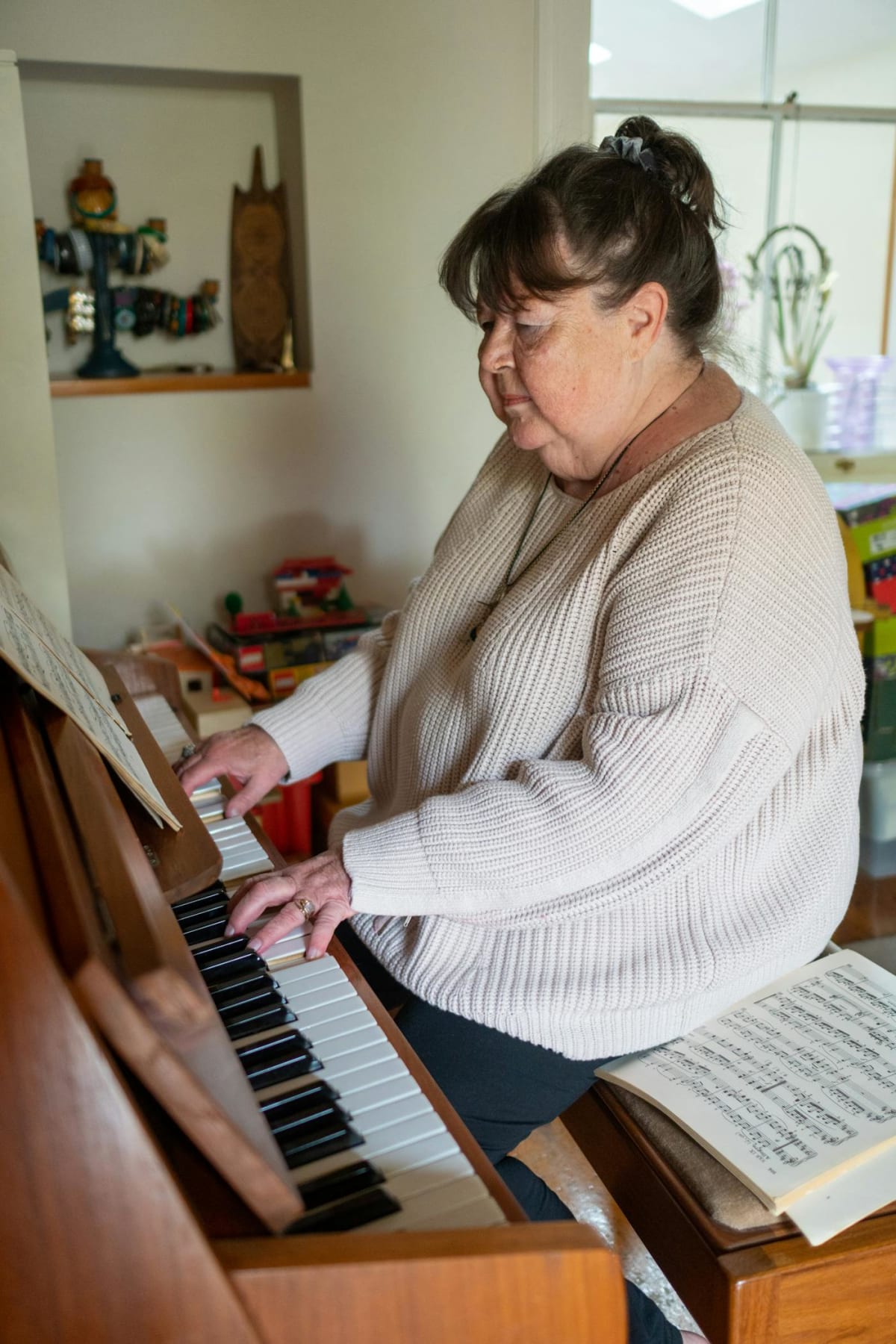 Adult learner working at the piano — the context for most pedaling practice