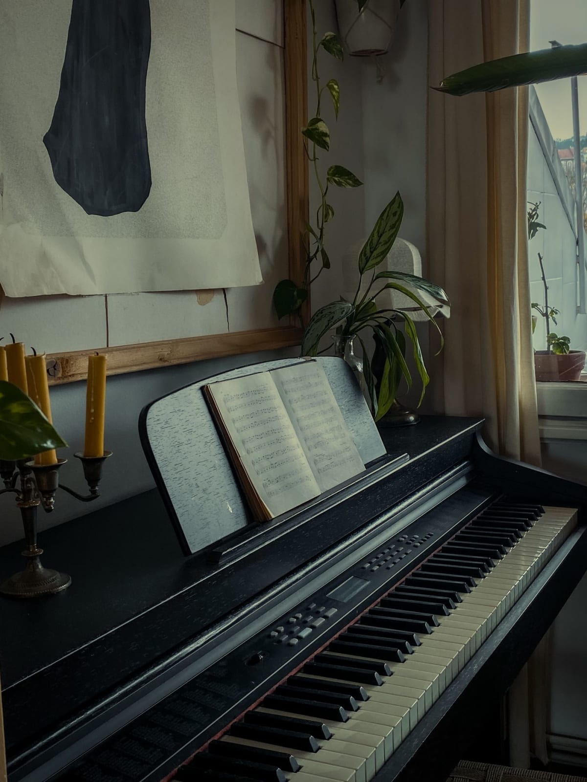 Open sheet music on a piano in a quiet home practice corner