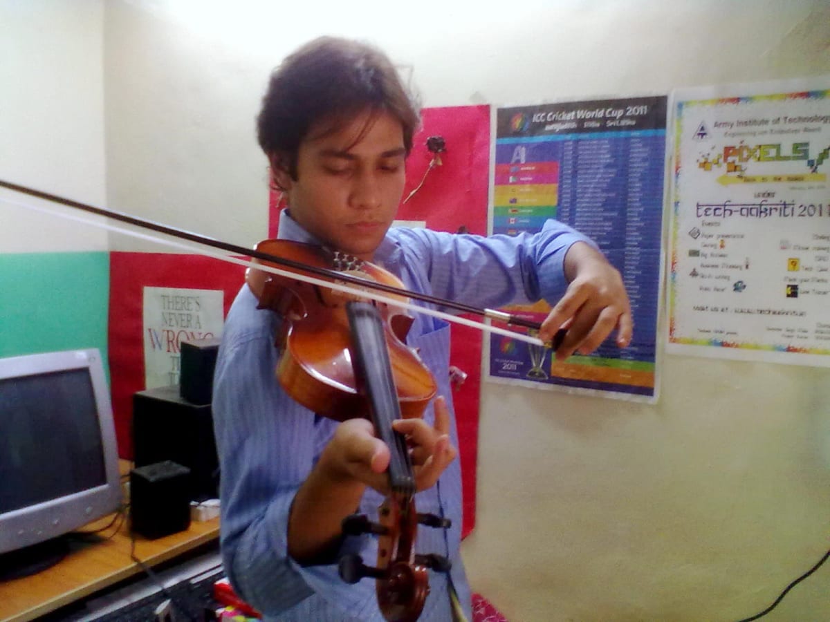 A student practising the violin from sheet music