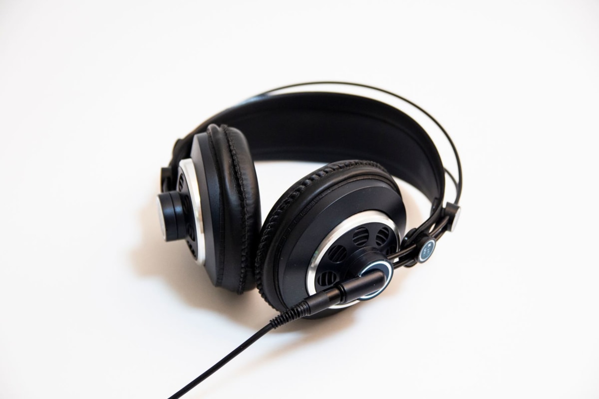 Close view of wired over-ear headphones showing the headband and padded ear cups