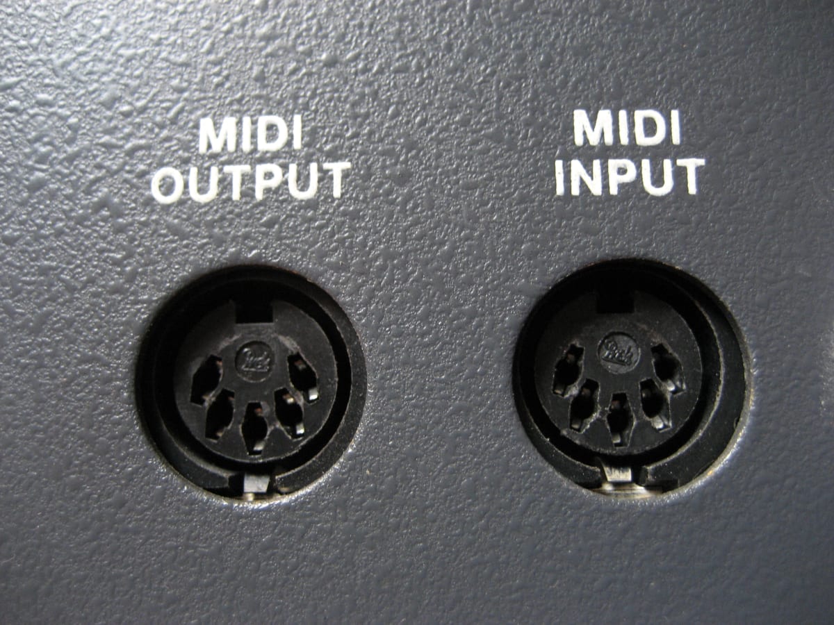 Two round five-pin MIDI sockets labelled MIDI OUTPUT and MIDI INPUT