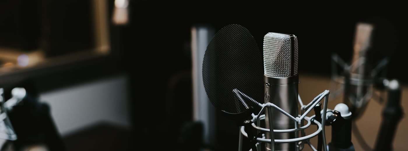 Podcast microphone setup in studio representing creator audio content