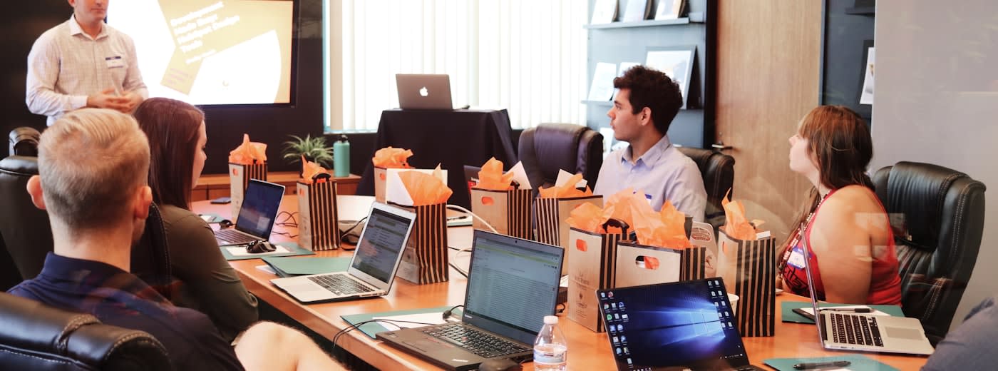 Team collaborating on content marketing strategy around a conference table